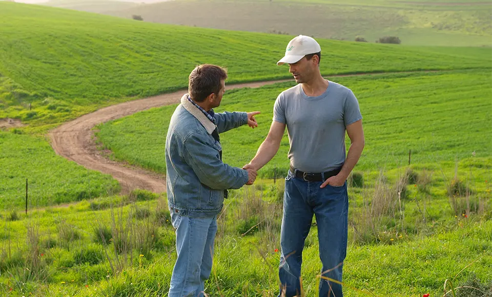 tama employees helping to framer